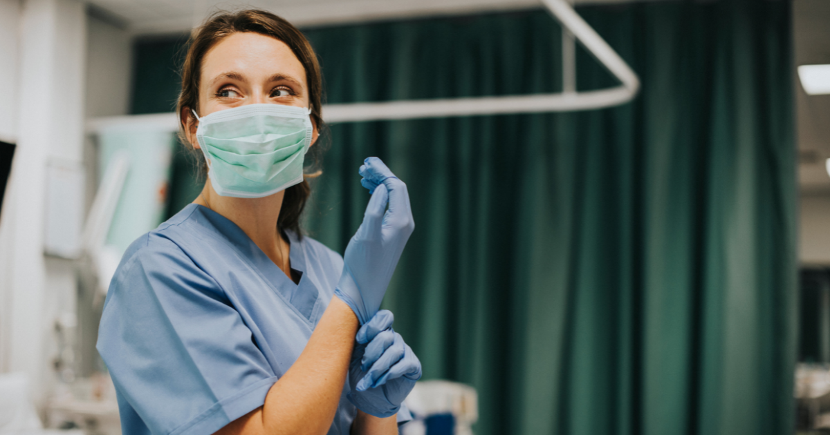 Pediatrix hospitalist physician puts on surgical gloves